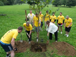 Mayor of Reading Jenny Rynn planting the first tree of the day with the riders