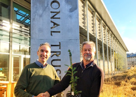 Fund4Trees trustee Gabriel Hemery receives a cutting from the Ankerwycke Yew from Ray Hawes of The National Trust